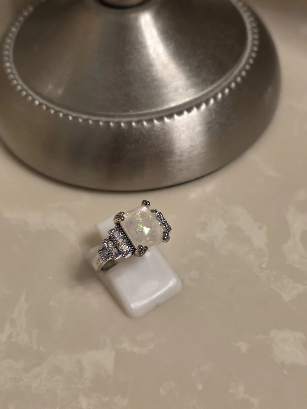 Opal Centerpiece Silver Ring with Sparkling Accent Stones